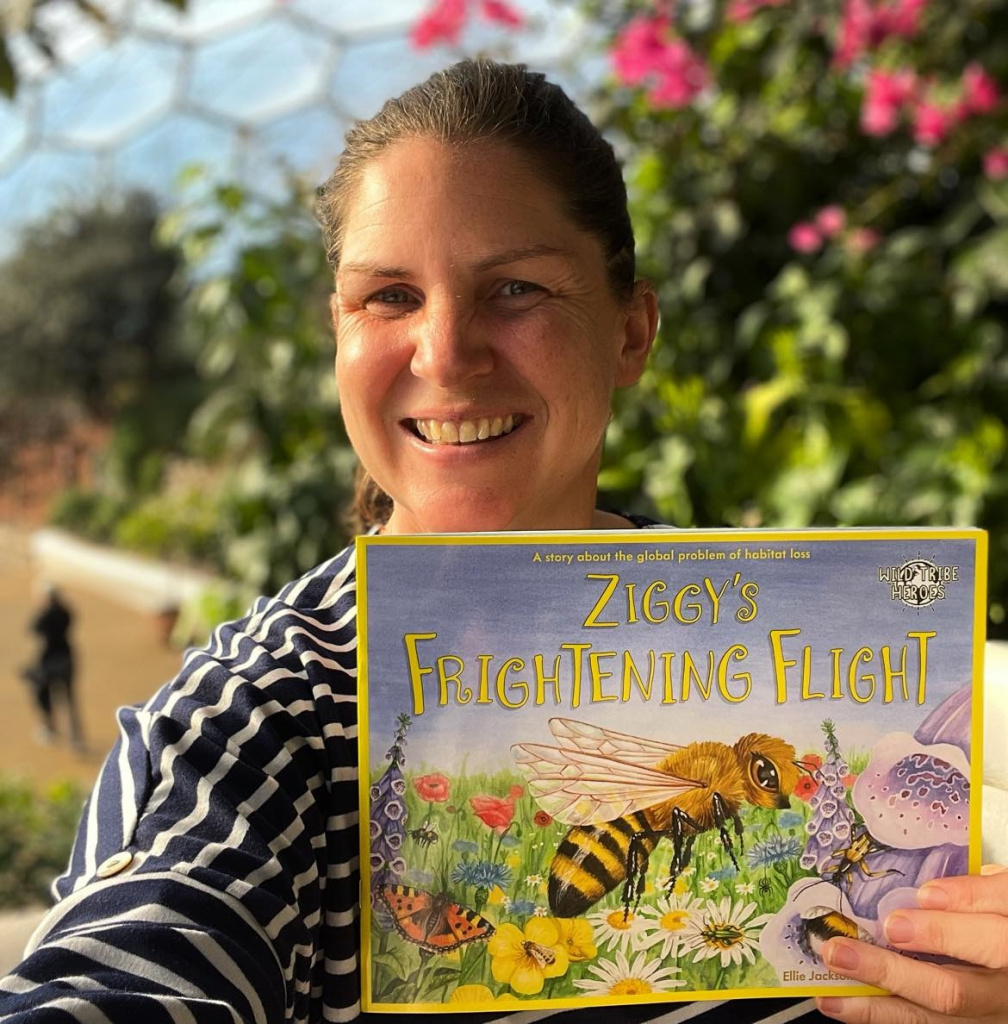 Children's author Ellie Jackson holding a copy of Ziggy's Frightening Flight book