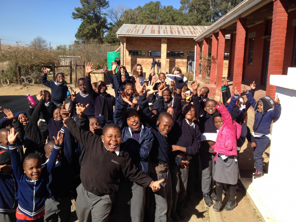 South African schoolchildren standing outside their school.