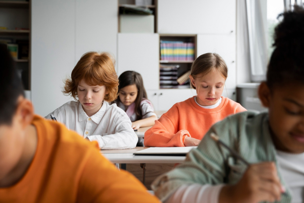 Elementary or primary school class writing during a lesson.