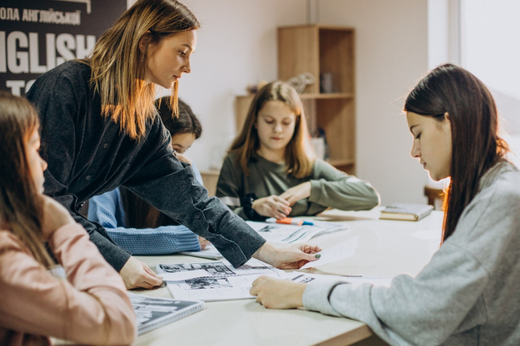 Secondary school students doing a group project in an English classroom.